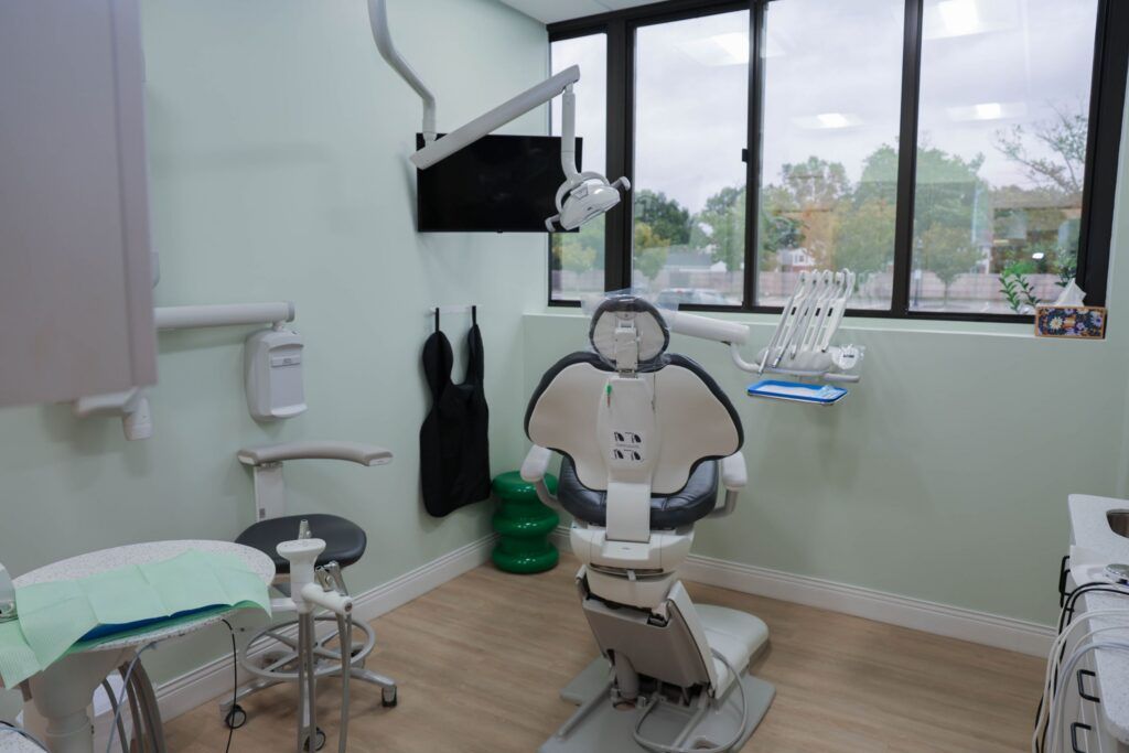 Elite Orthodontics Studio office treatment room with a dental chair and large windows