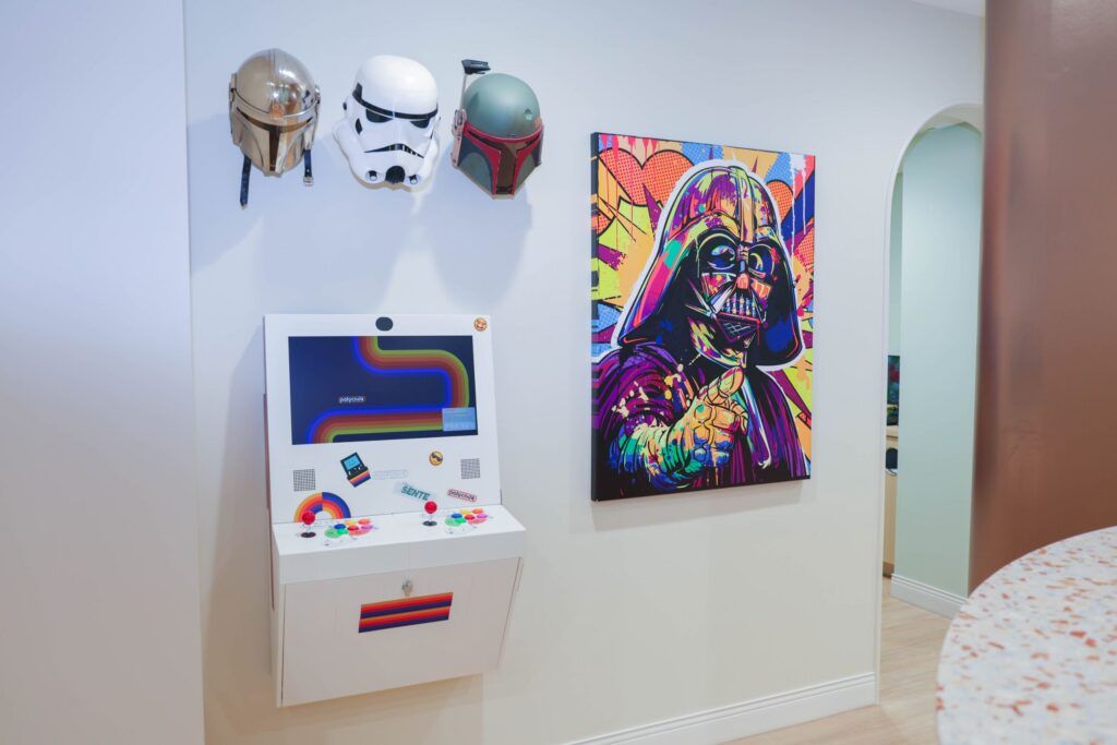 Elite Orthodontics Studio office wall with an arcade game and colorful pop art display